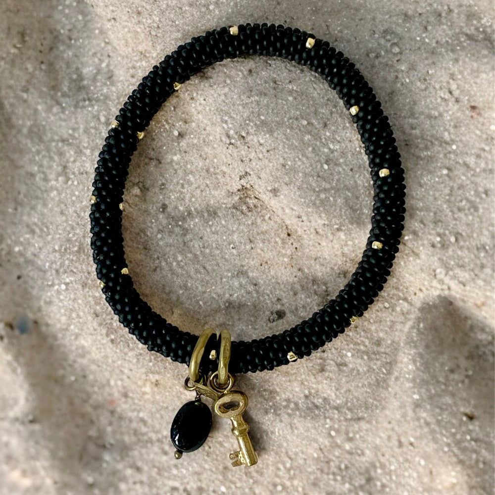 
                      
                        Armband Jacky, schwarz-gold, Black Onyx
                      
                    